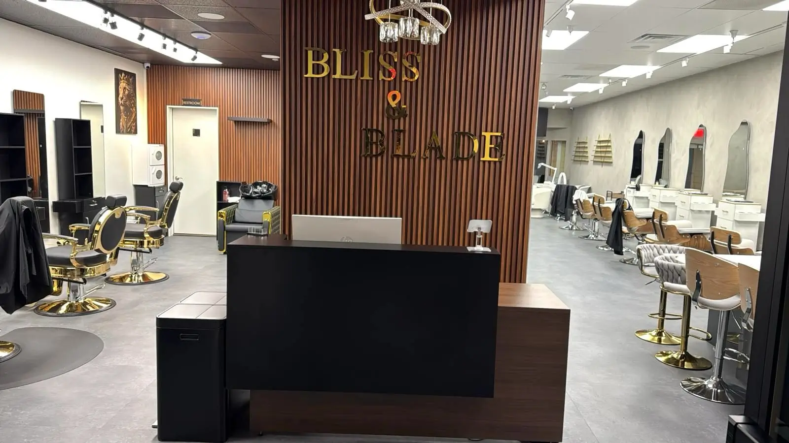 Beauty salon and barbershop areas inside Bliss & Blade